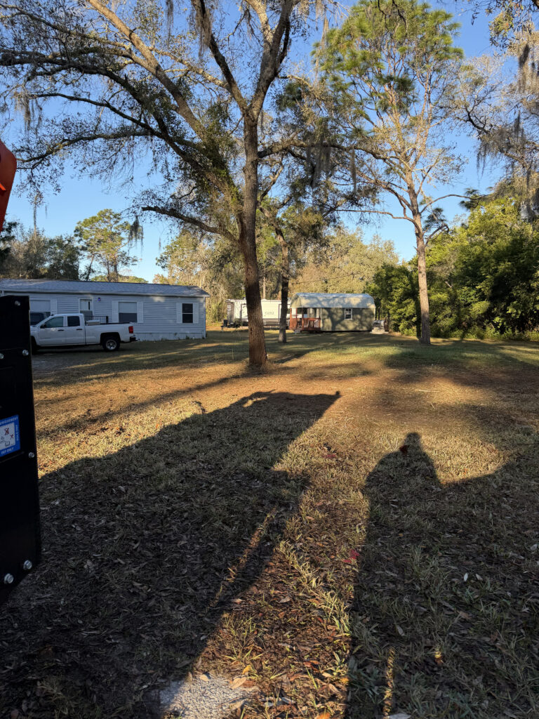 Newly cleared yard surrounding mobile home property